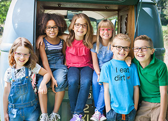 group of children wearing glasses